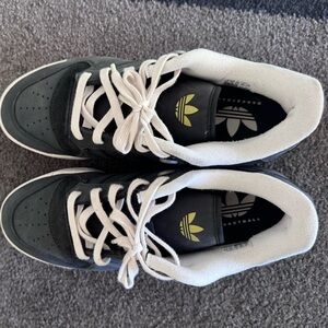 Adidas Black and White Sneakers with Yellow Logo